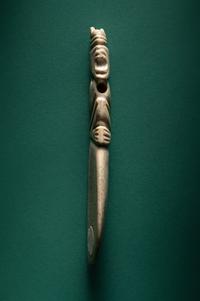 A Costa Rican White Jade Axe Pendant of a Crouching Monkey
