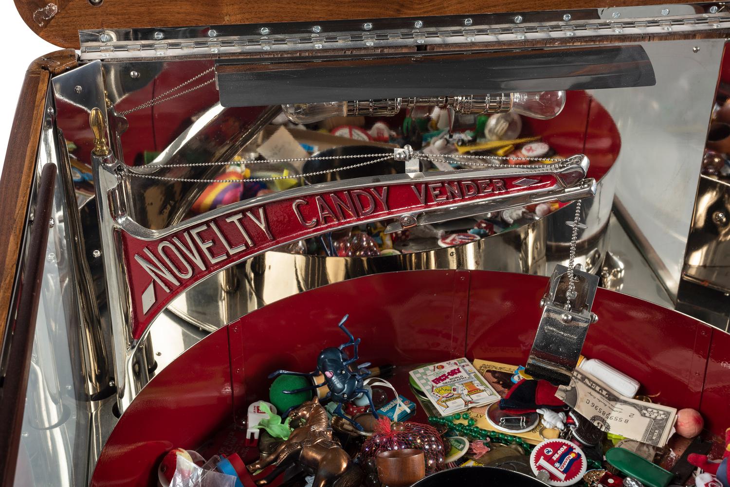 An Exhibit Supply Co. Novelty Candy Vender Claw Machine