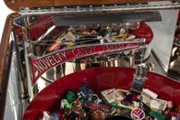 An Exhibit Supply Co. Novelty Candy Vender Claw Machine