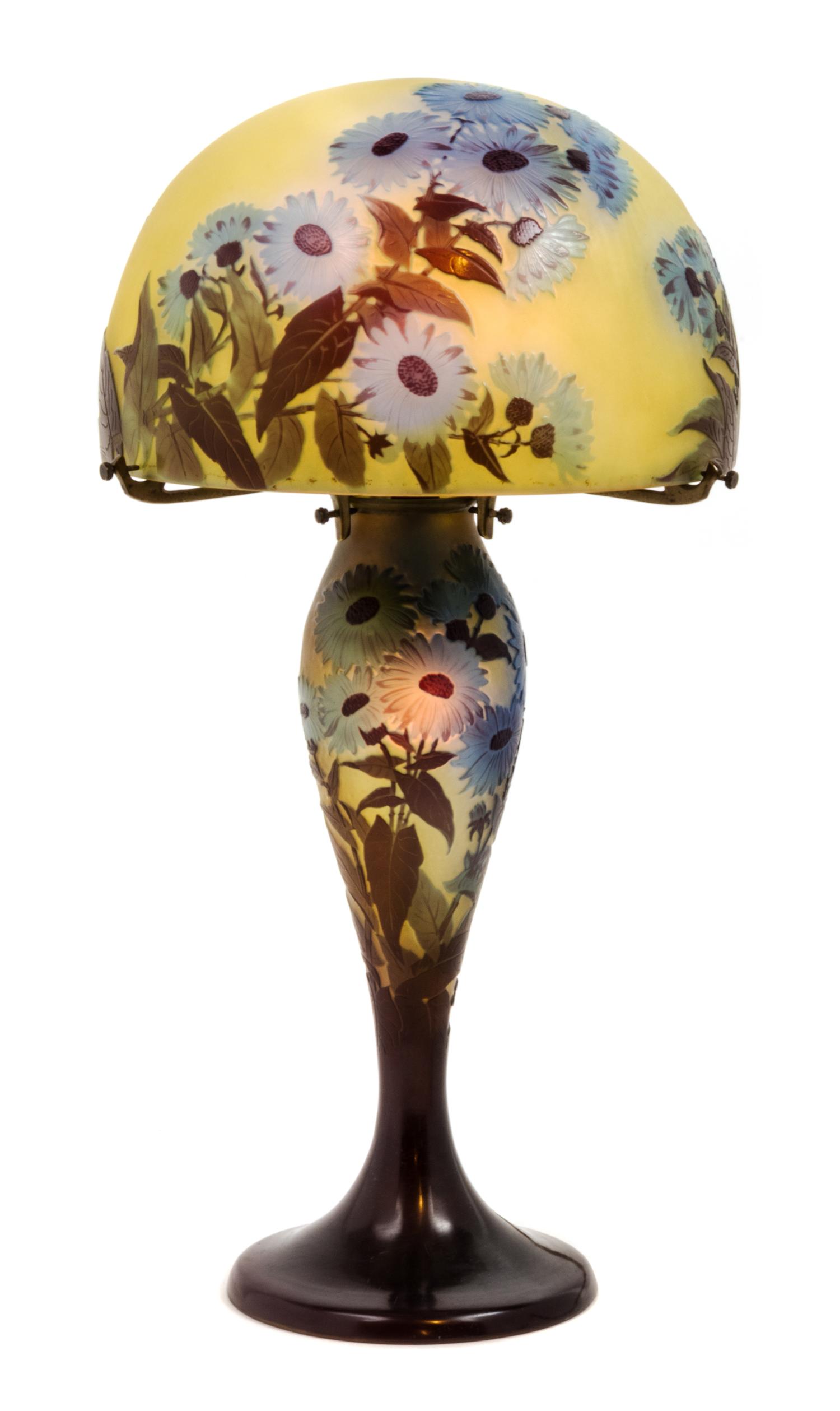 Emile Galle, (French, 1846-1904), a cameo glass lamp, the domed shade and baluster form base decorated with blue flowers