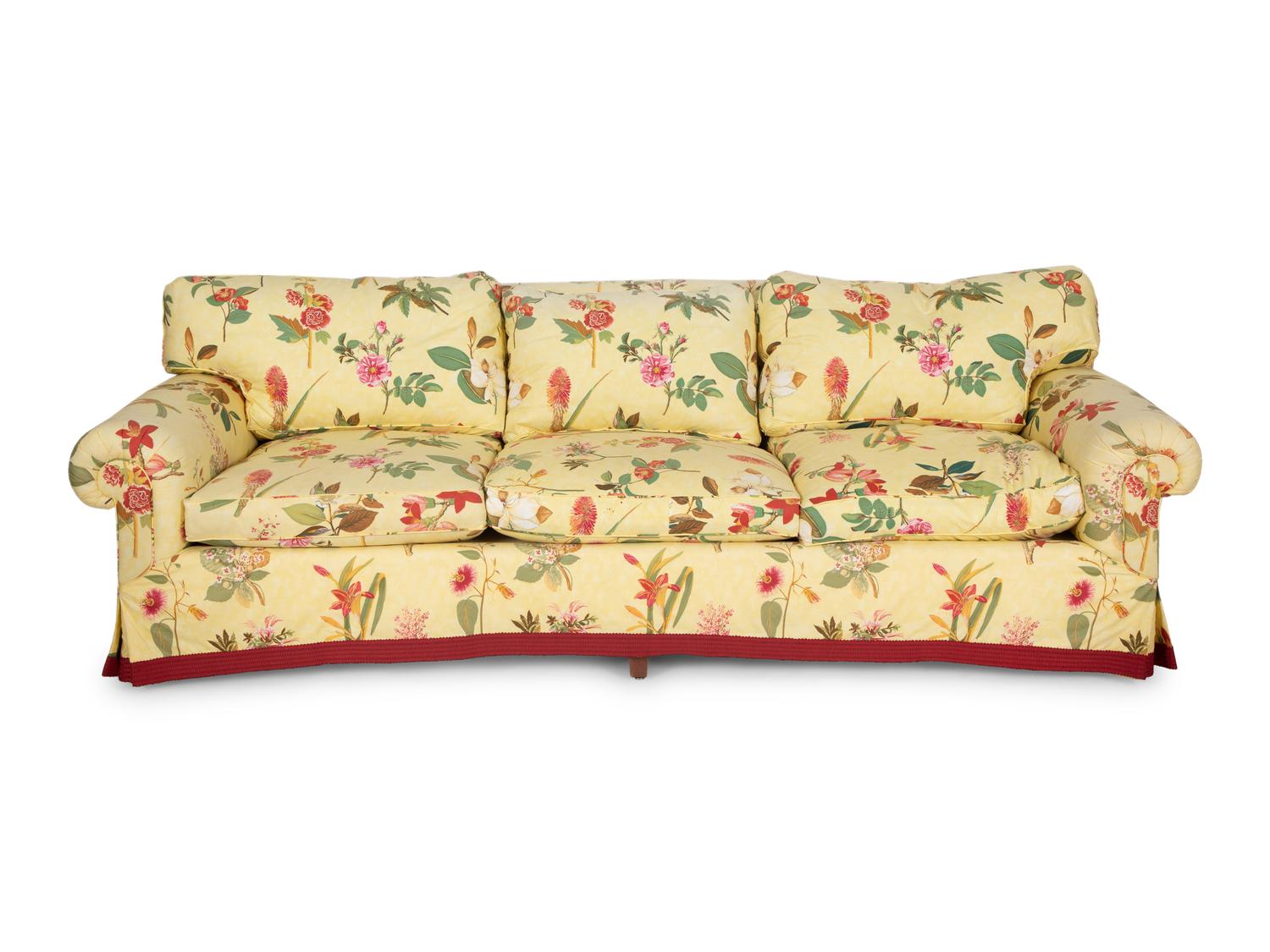 A Yellow Floral Chintz Upholstered Sofa and a Pair of Matching Drapes