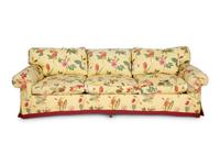A Yellow Floral Chintz Upholstered Sofa and a Pair of Matching Drapes