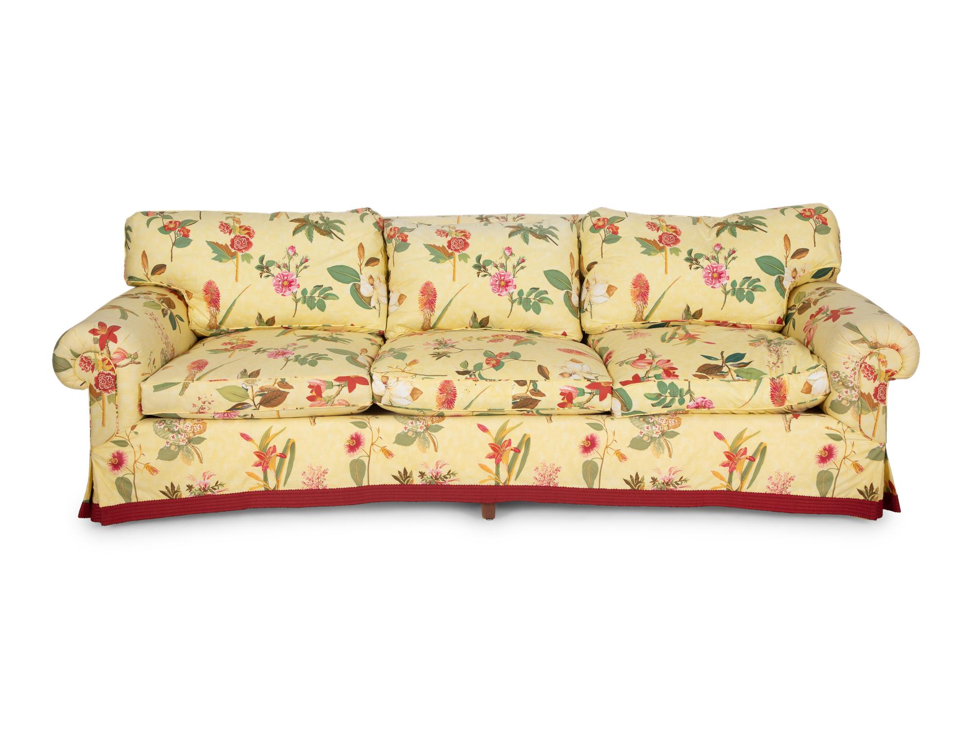 A Yellow Floral Chintz Upholstered Sofa and a Pair of Matching Drapes