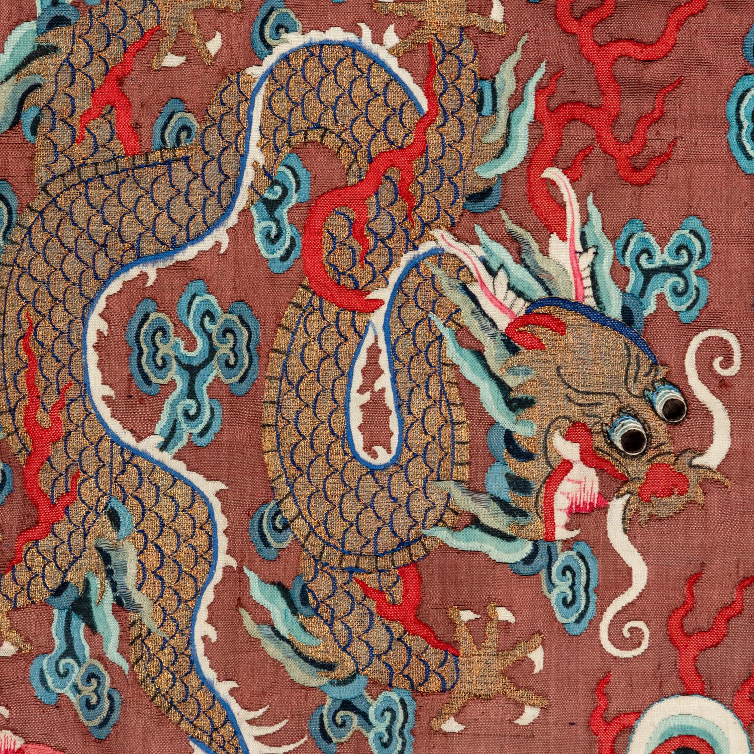 A Chinese Brown Ground Kesi Silk 'Dragon' Robe, Jifu, 19th Century 清晚期 醬地緙絲雲龍紋吉服
