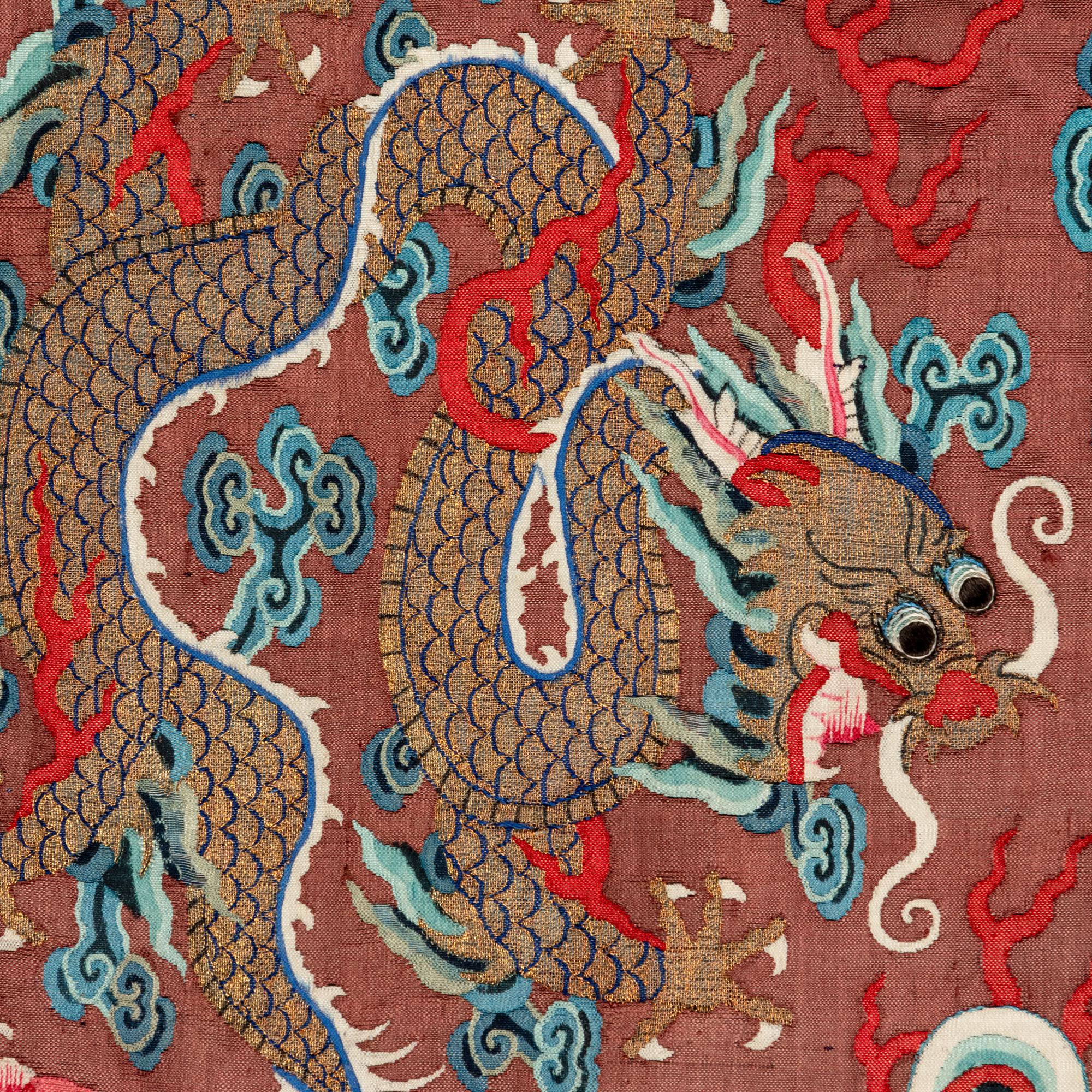 A Chinese Brown Ground Kesi Silk 'Dragon' Robe, Jifu, 19th Century 清晚期 醬地緙絲雲龍紋吉服