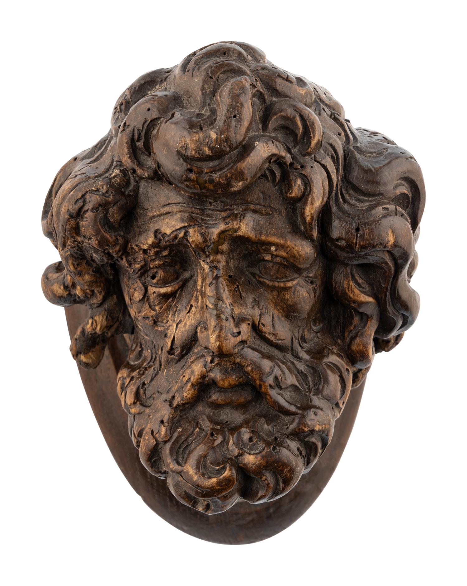 A Continental Carved Oak Head of a Saint