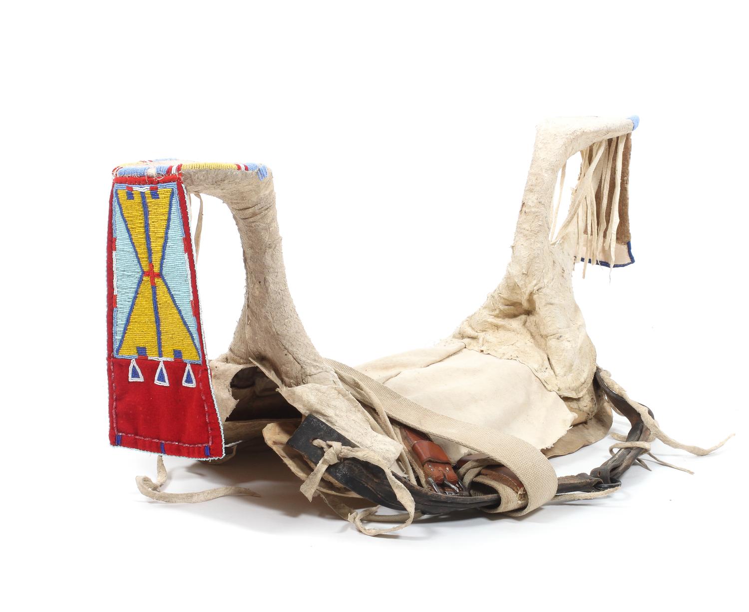 A Crow Beaded Saddle Height 16 x length 29 1/2 x width 10 inches.