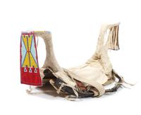 A Crow Beaded Saddle Height 16 x length 29 1/2 x width 10 inches.