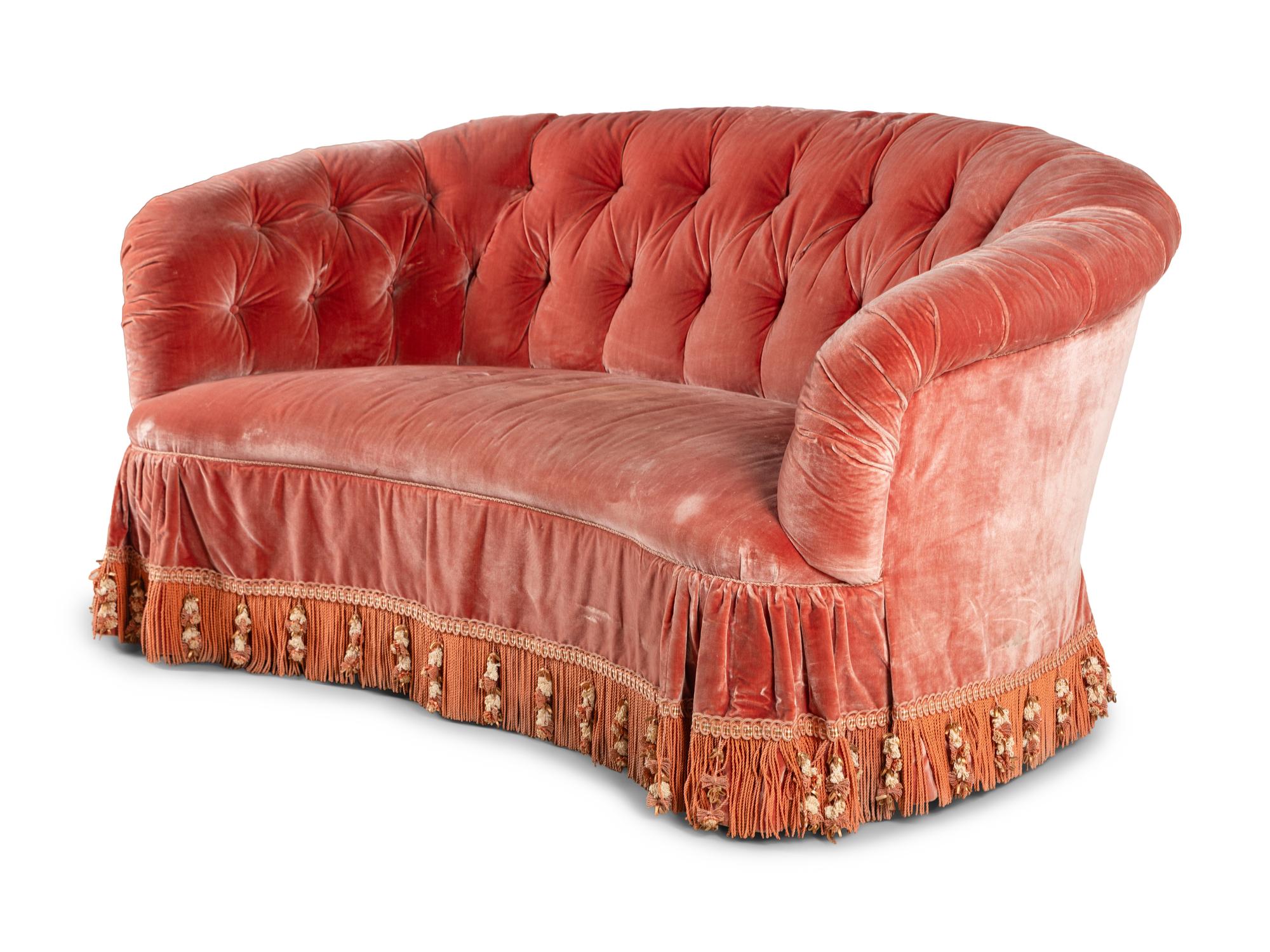 A Button-Tufted Velvet Reniform Sofa