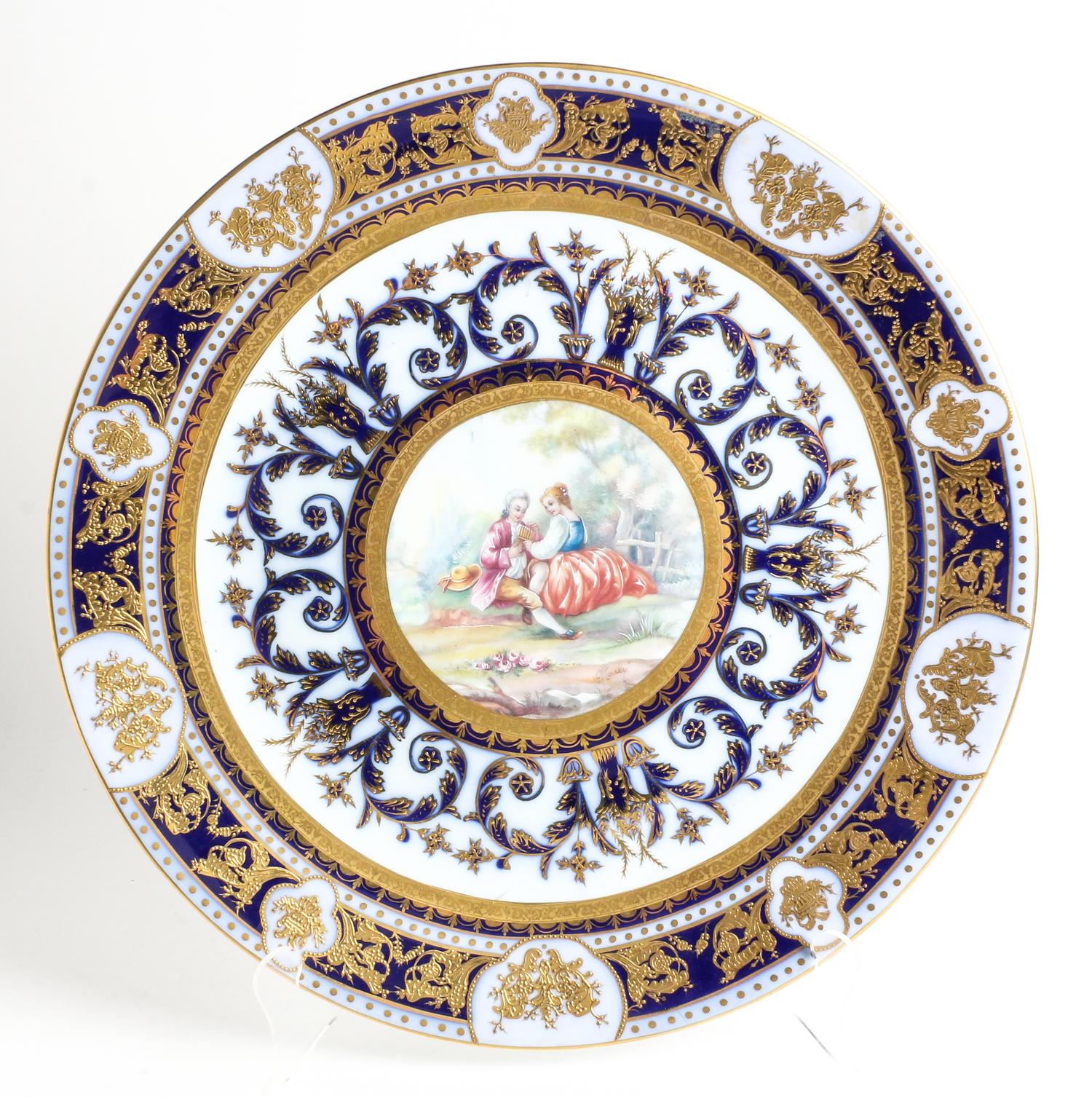 A German Polychrome and Parcel Gilt Porcelain Charger Diameter 16 3/4 inches. — SPURIOUS KPM MARK ON UNDERSIDE, 20TH CENTURY