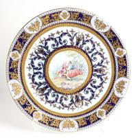 A German Polychrome and Parcel Gilt Porcelain Charger Diameter 16 3/4 inches. — SPURIOUS KPM MARK ON UNDERSIDE, 20TH CENTURY