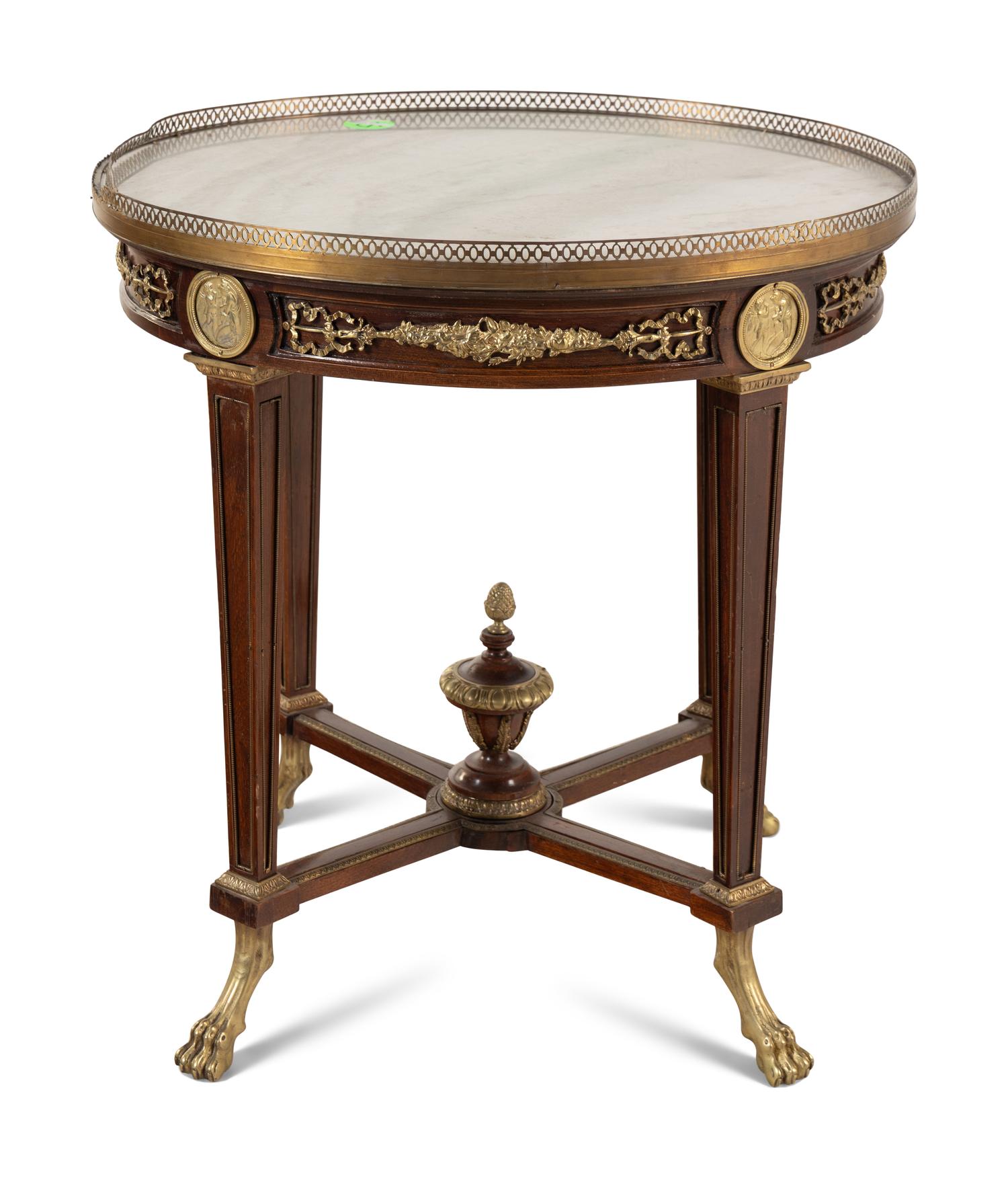A Louis XVI Style Gilt Bronze Mounted Occasional Table