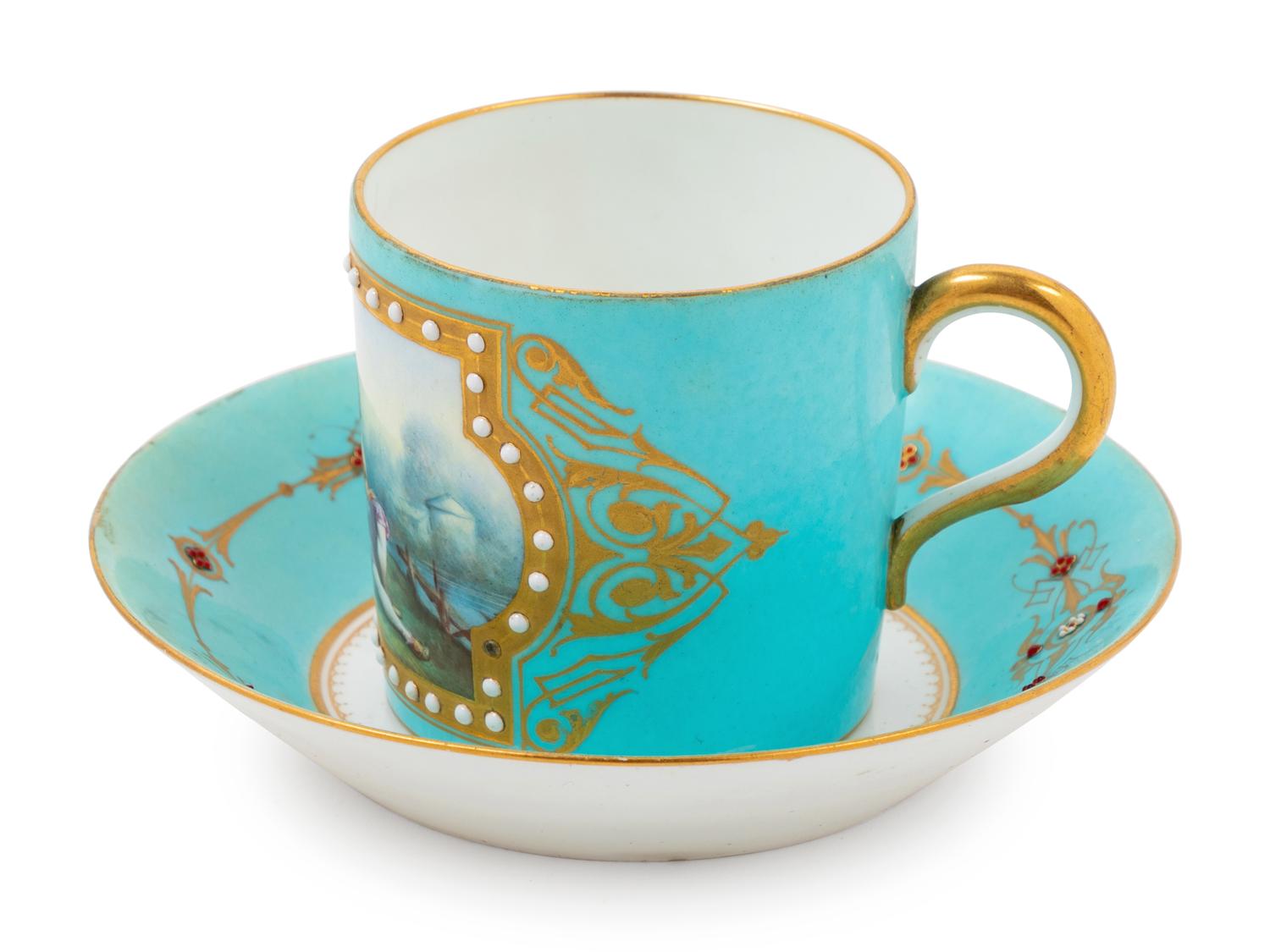 A Sèvres Style "Jeweled" Porcelain Cup and Saucer