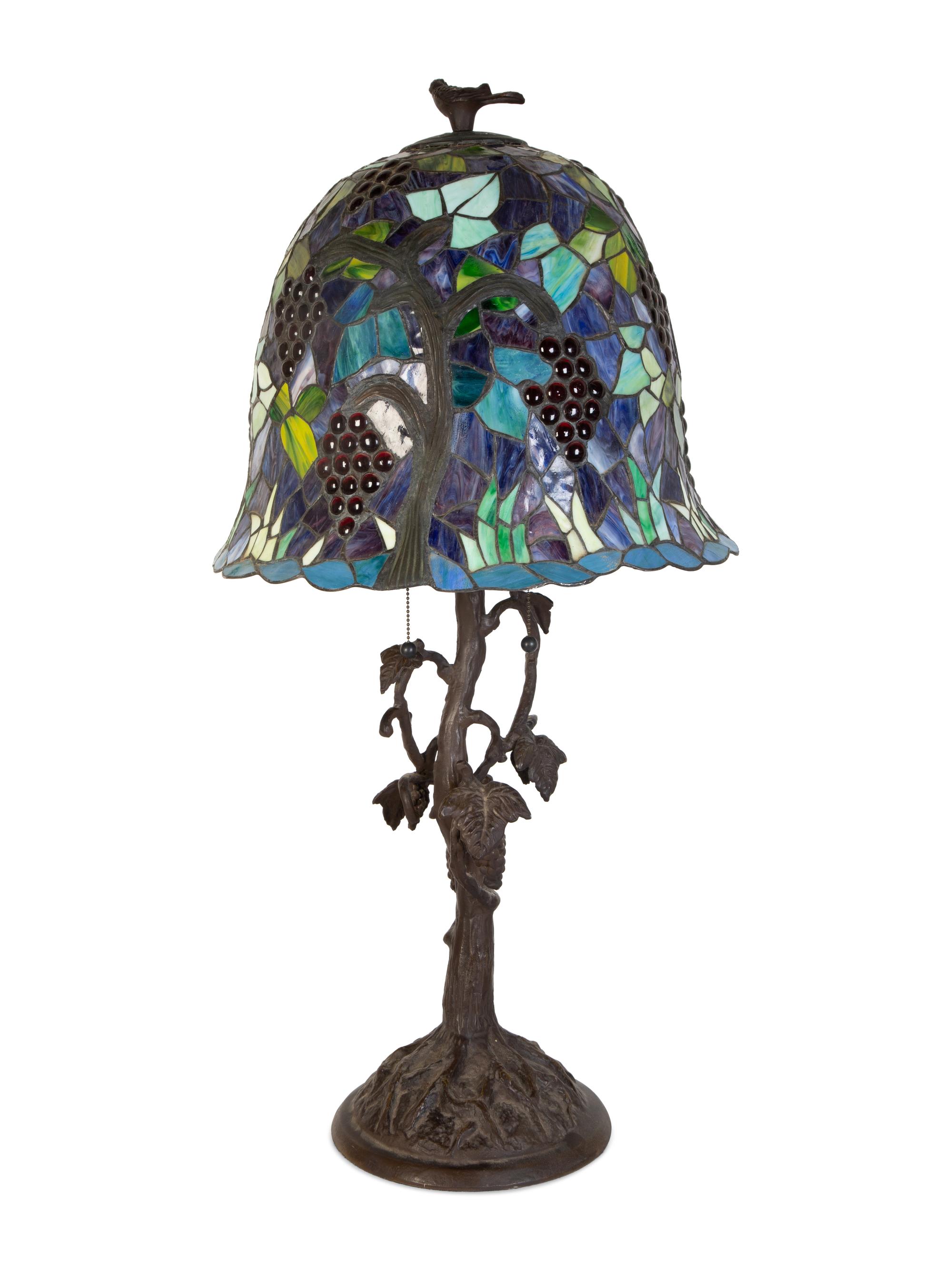 A Leaded Glass and Cast Metal Table Lamp