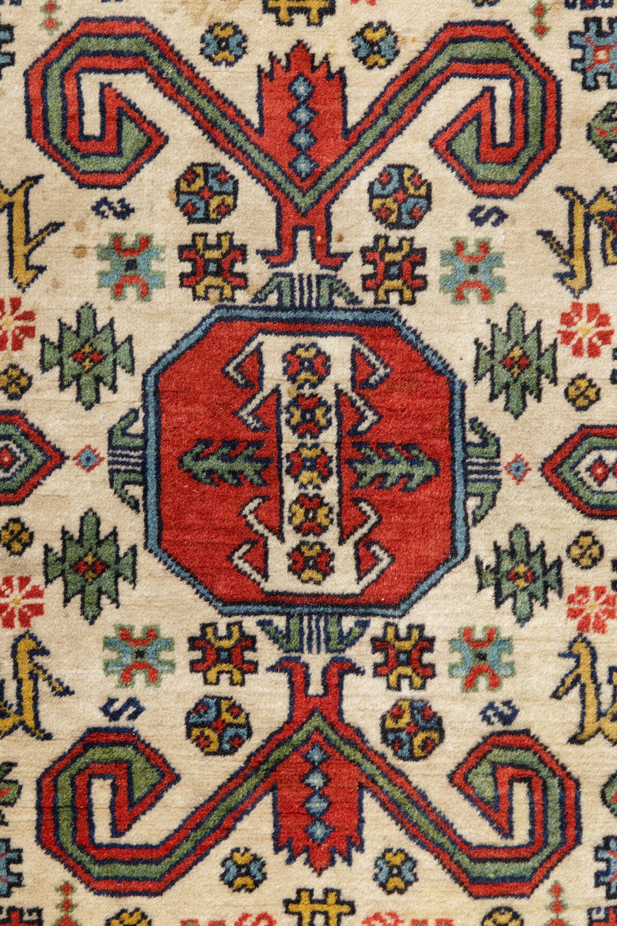 A Perepedil Ivory-Ground Wool Rug
