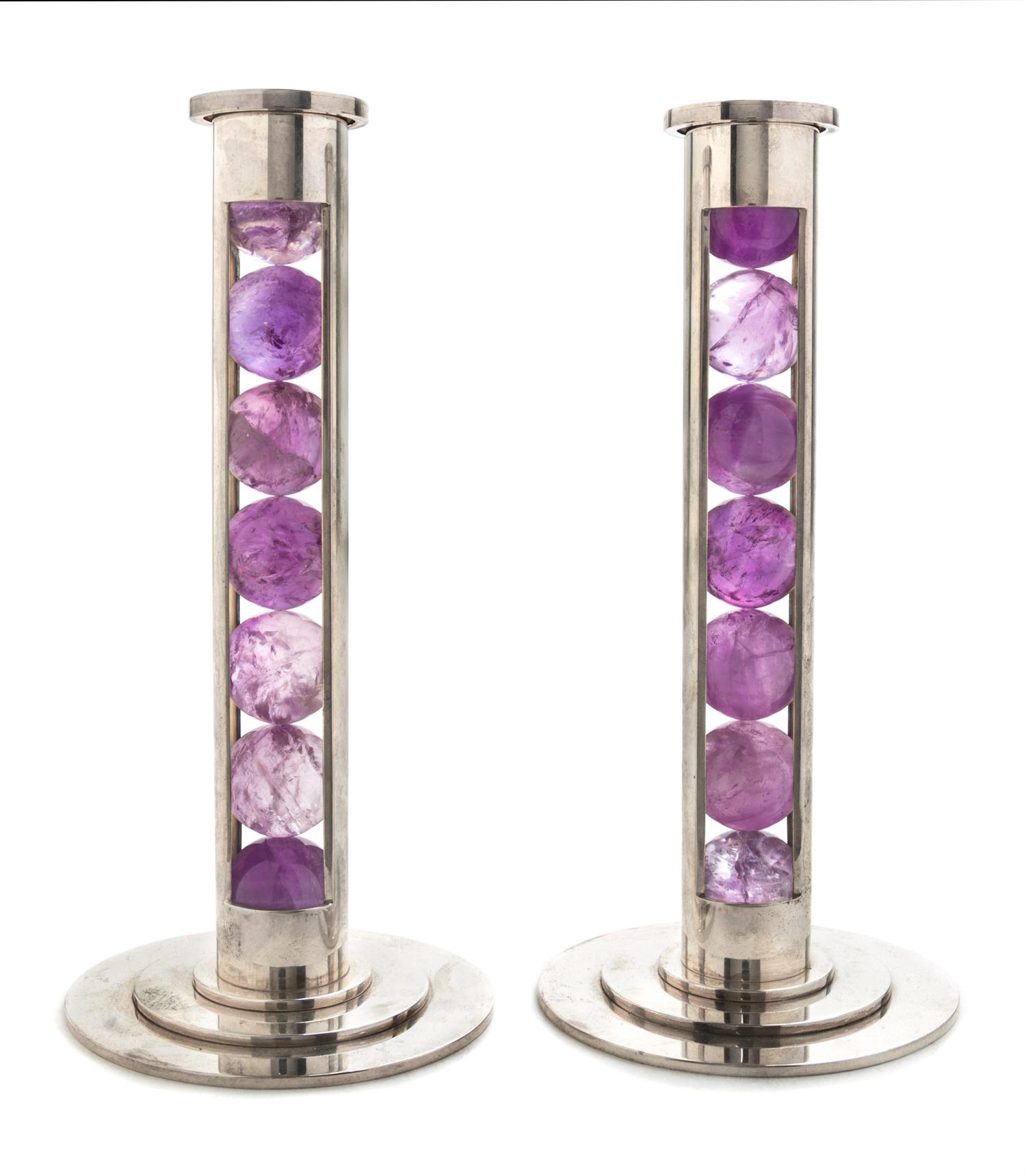 A Pair of Elizabeth II Silver and Amethyst Candlesticks, Paul Belvoir, London, 2007, each of cylindrical column form enclosing seven am