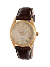 ROLEX, REF. 6565, 18K YELLOW GOLD VINTAGE 'OYSTER PERPETUAL ' WATCH WITH HONEYCOMB DIAL, CIRCA 1956