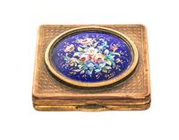 A French Enameled Gilt Metal Compact, 20th Century, of square form, the hinged lid decorated with a round enameled plaque depicting a p