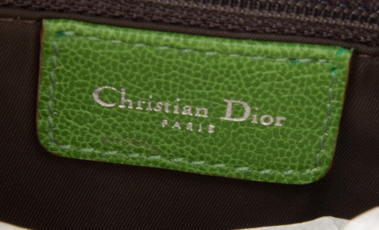 A Christian Dior Rasta Zipper Saddle Handbag, 10" x 7" x 2".