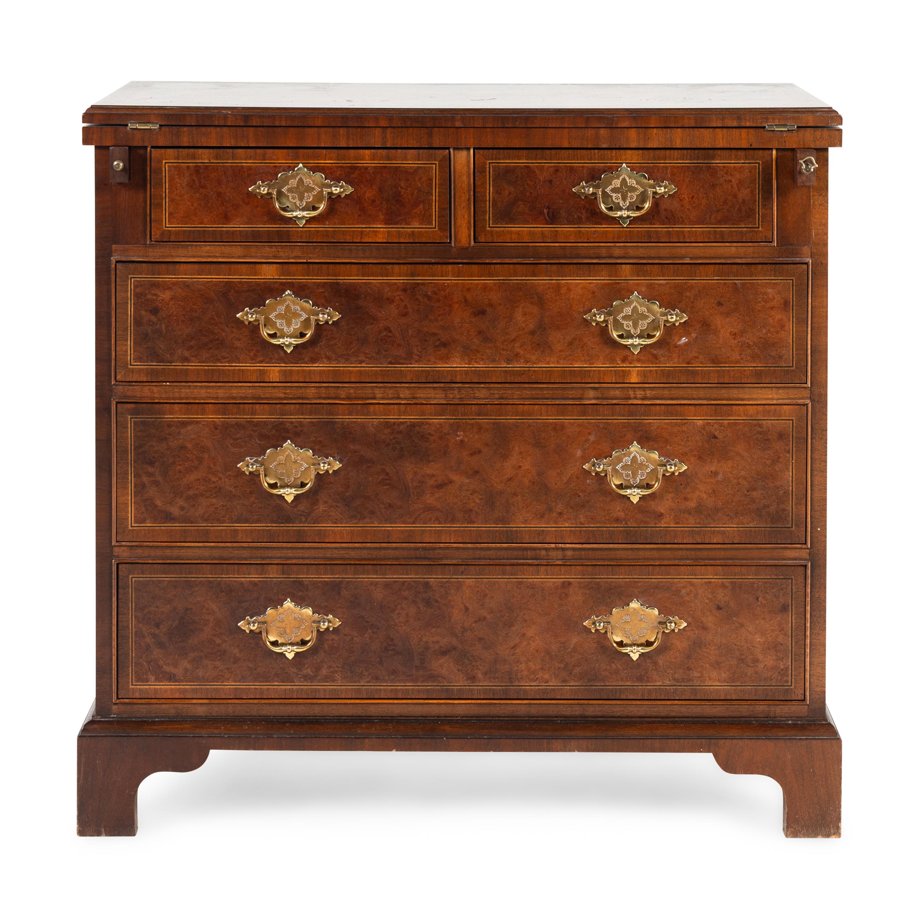 A Baker George III Style Walnut and Mahogany Bachelor's Chest