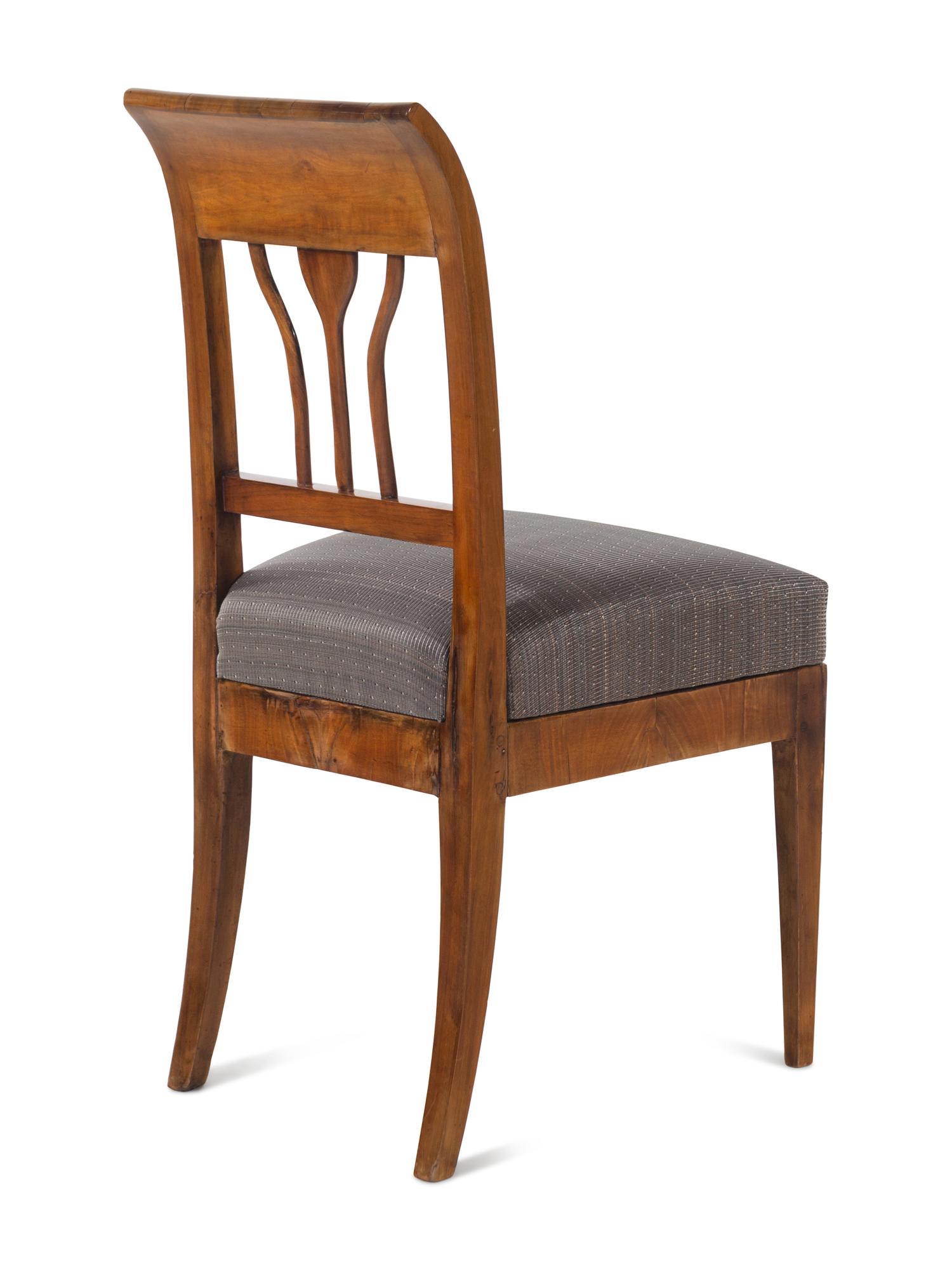 An Austrian Neoclassical Burlwood Writing Table and Chair