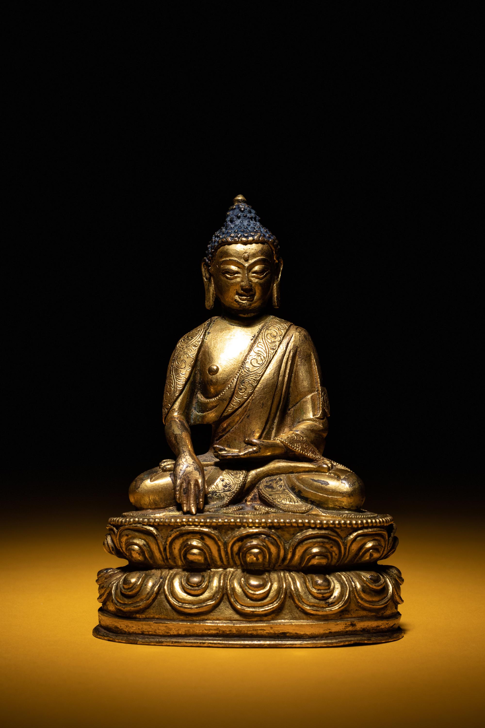 A Small Sino-Tibetan Gilt Bronze Figure of Seated Buddha Shakyamuni