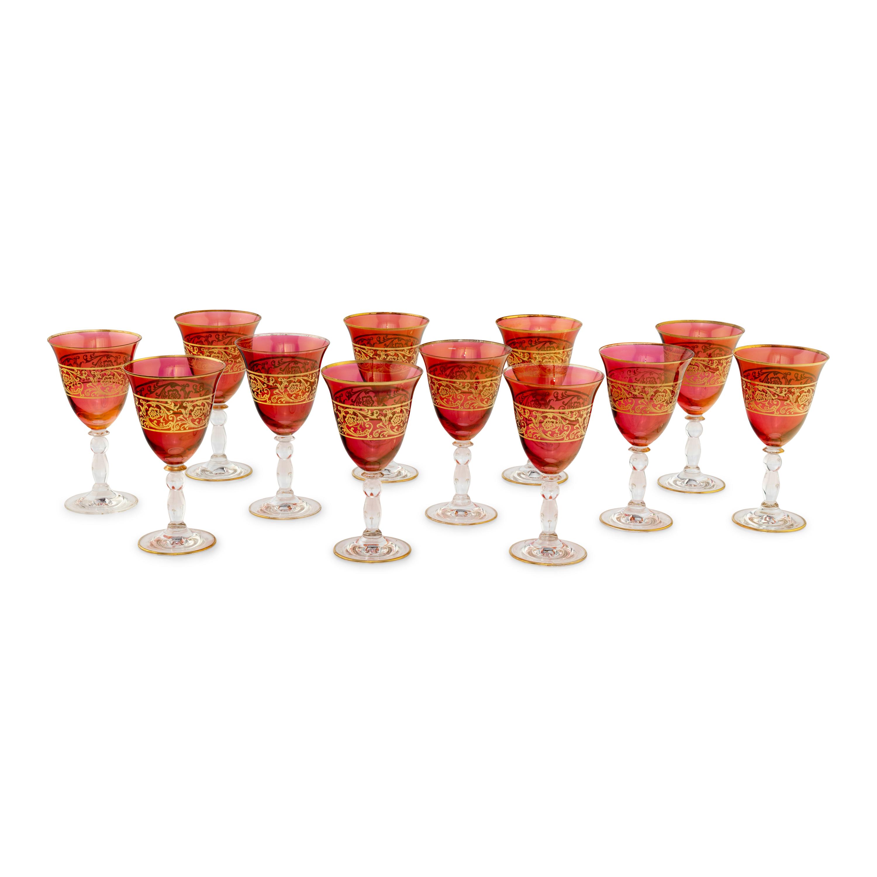 A Set of Parcel Gilt And Colored Glass Wine Stems