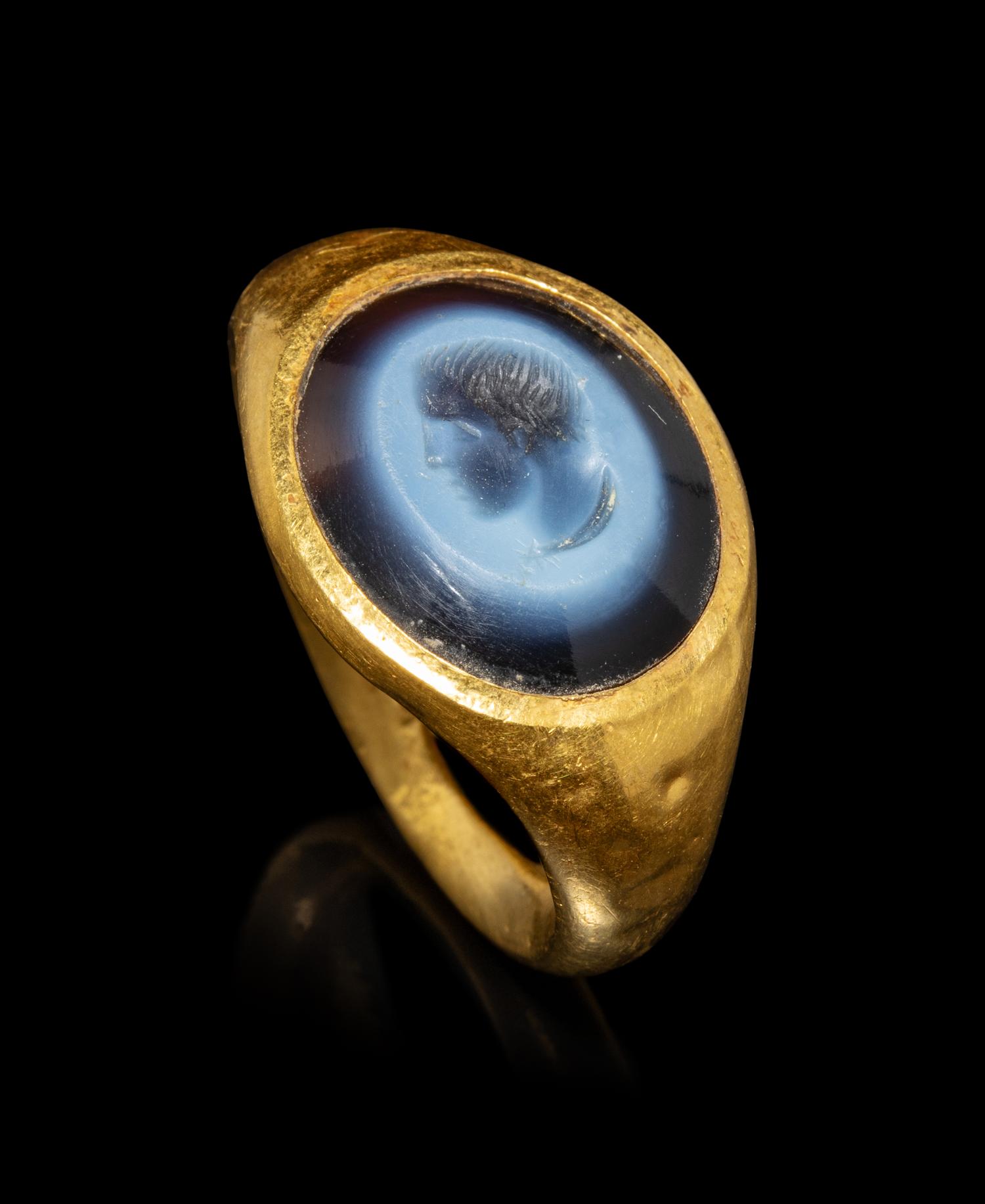 A Roman Gold and Nicolo Finger Ring with a Bust of a Youth