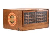 A Dewhurst's "Sylko" Stenciled Oak Spool Cabinet