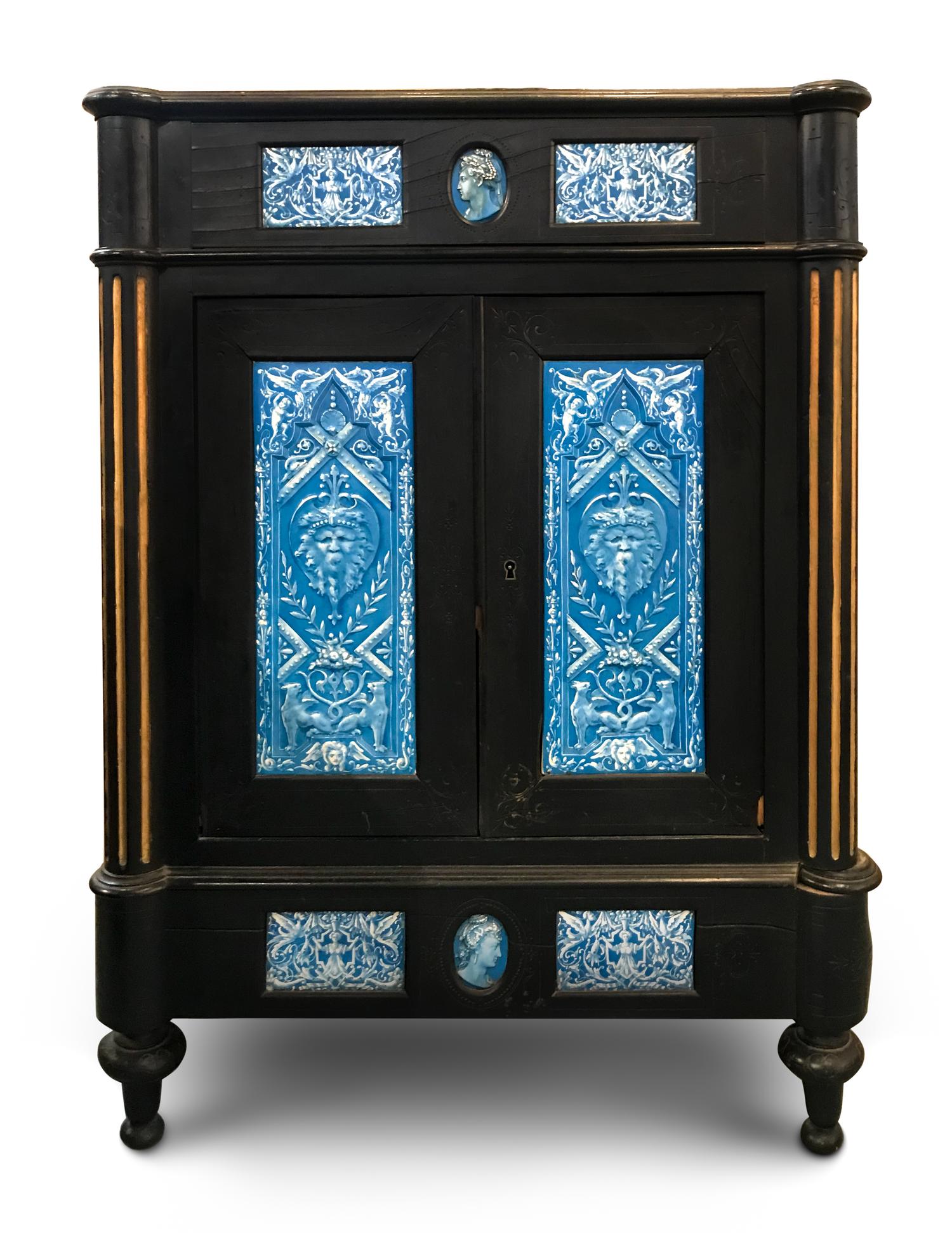 A Continental Blue Faience-Mounted Ebonized Cabinet