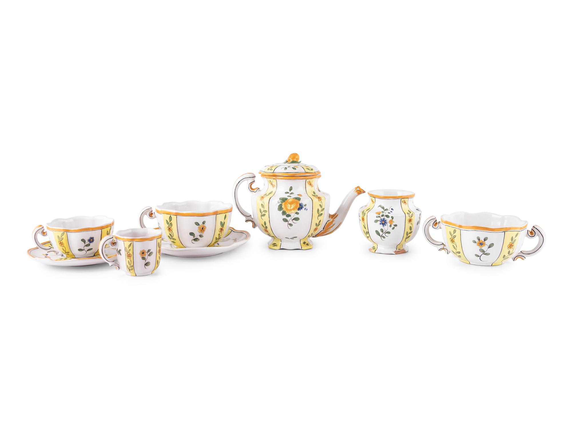 A French Hand Painted Faience Dinner Service