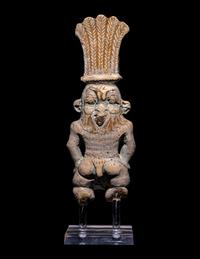 An Egyptian Bichrome Faience Double-Sided Bes