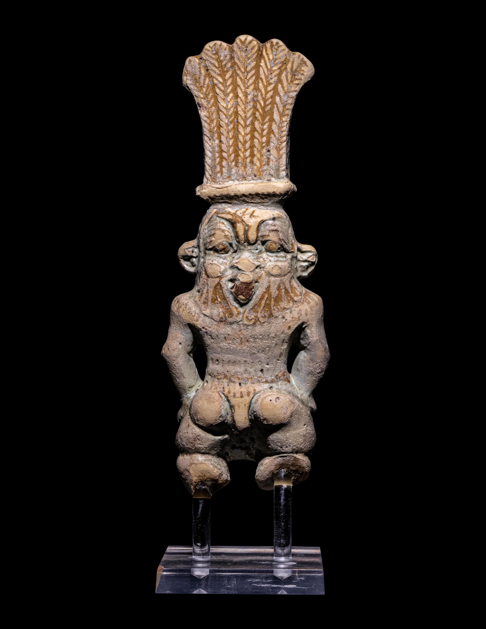 An Egyptian Bichrome Faience Double-Sided Bes