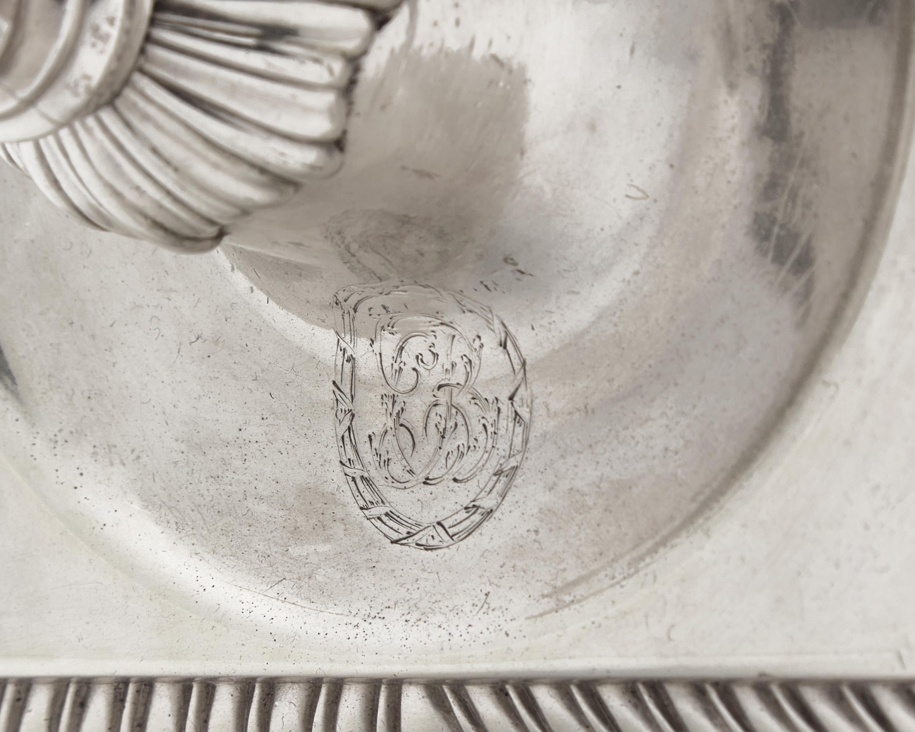 An Assembled Set Of Four George III Sterling Silver Candlesticks