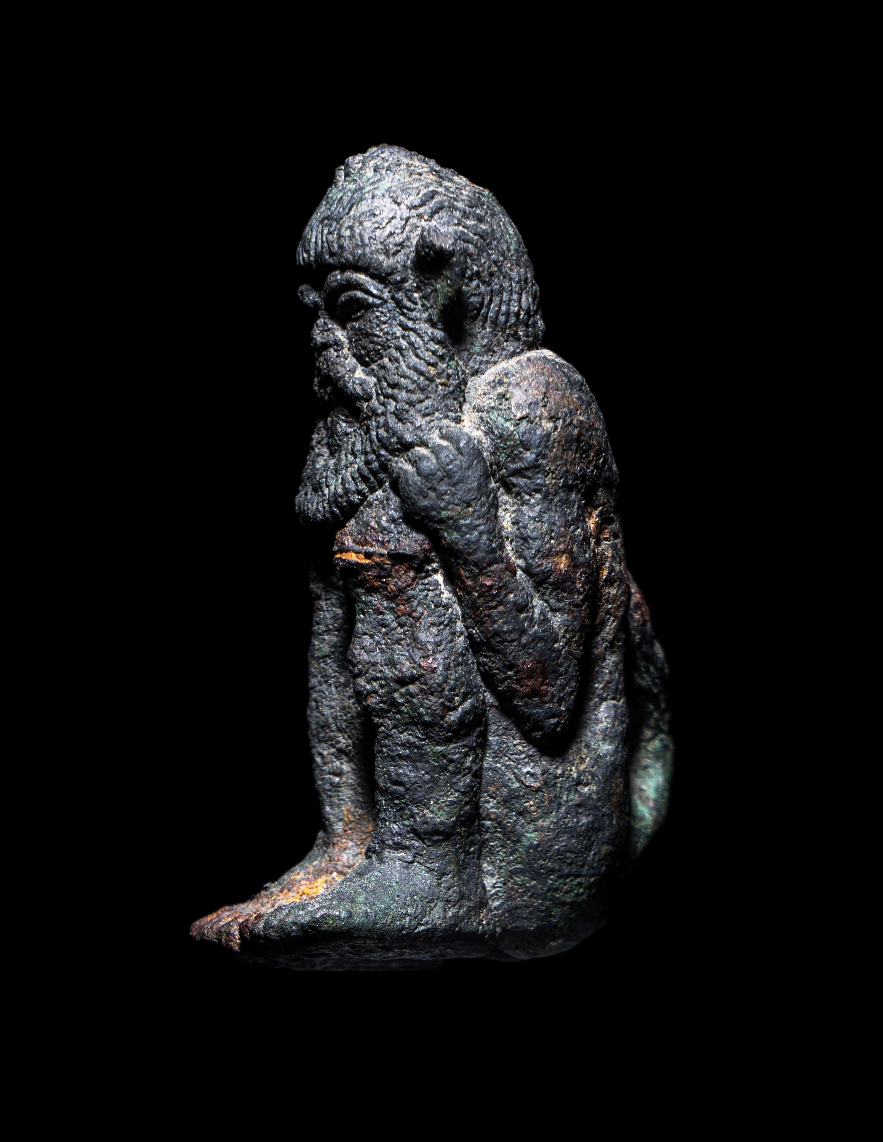 A Greek Bronze Satyr