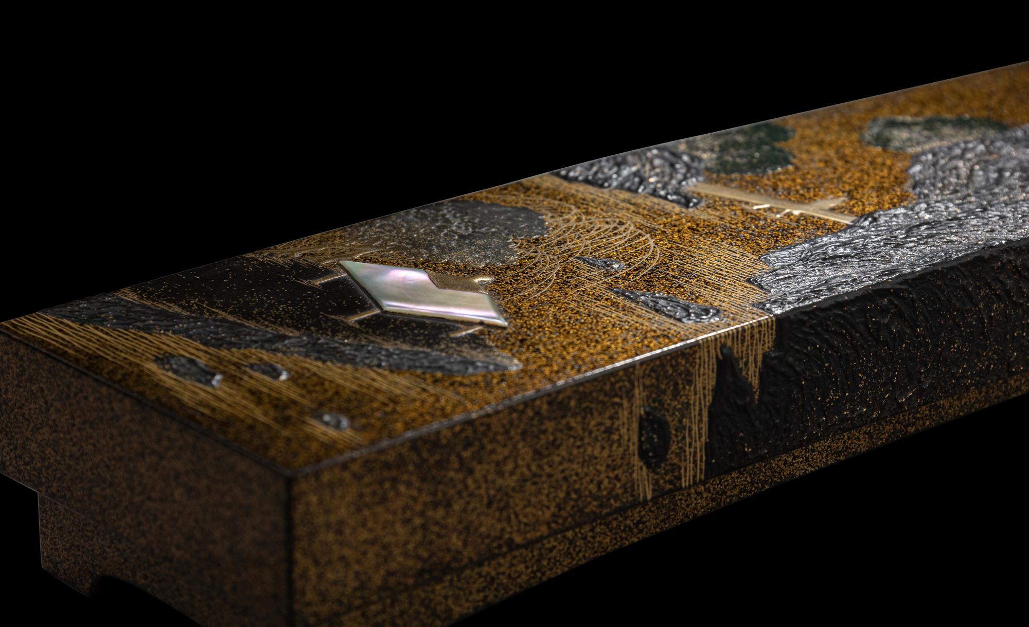 A Japanese Gold and Black Lacquer Rectangular Covered Box