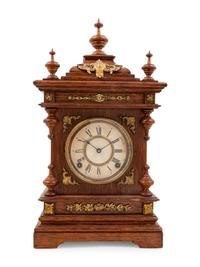 An Ansonia Cabinet A Brass Mounted Oak Shelf Clock