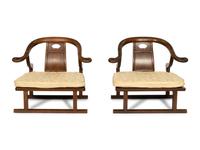 A Pair of Baker Furniture Walnut Horseshoe Back Chairs