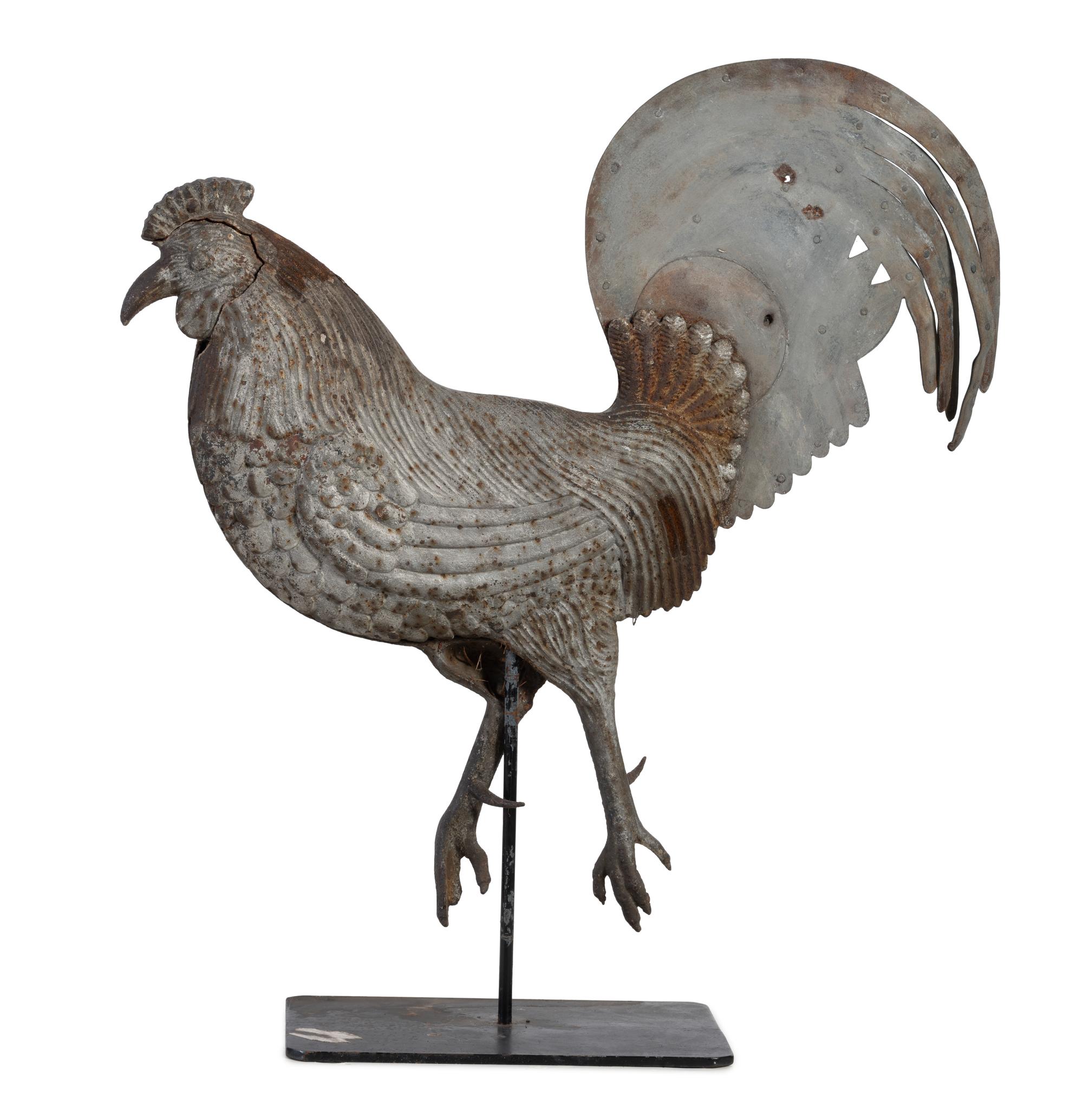 A Cast Iron and Tin Rooster Weathervane and Tin Heron