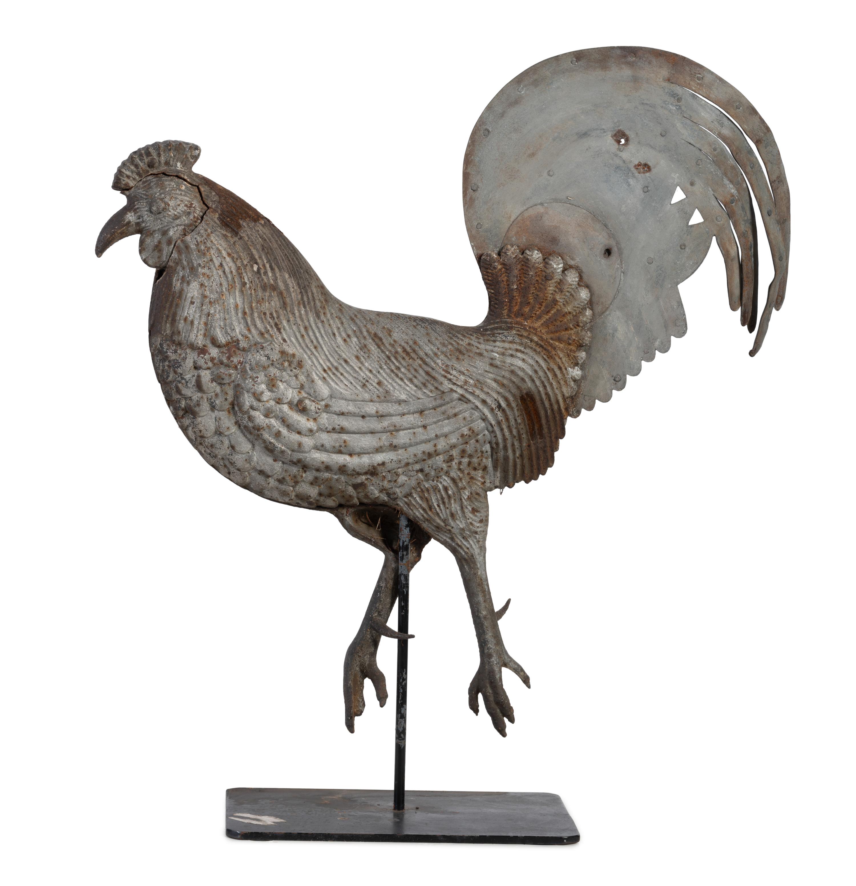 A Cast Iron and Tin Rooster Weathervane and Tin Heron