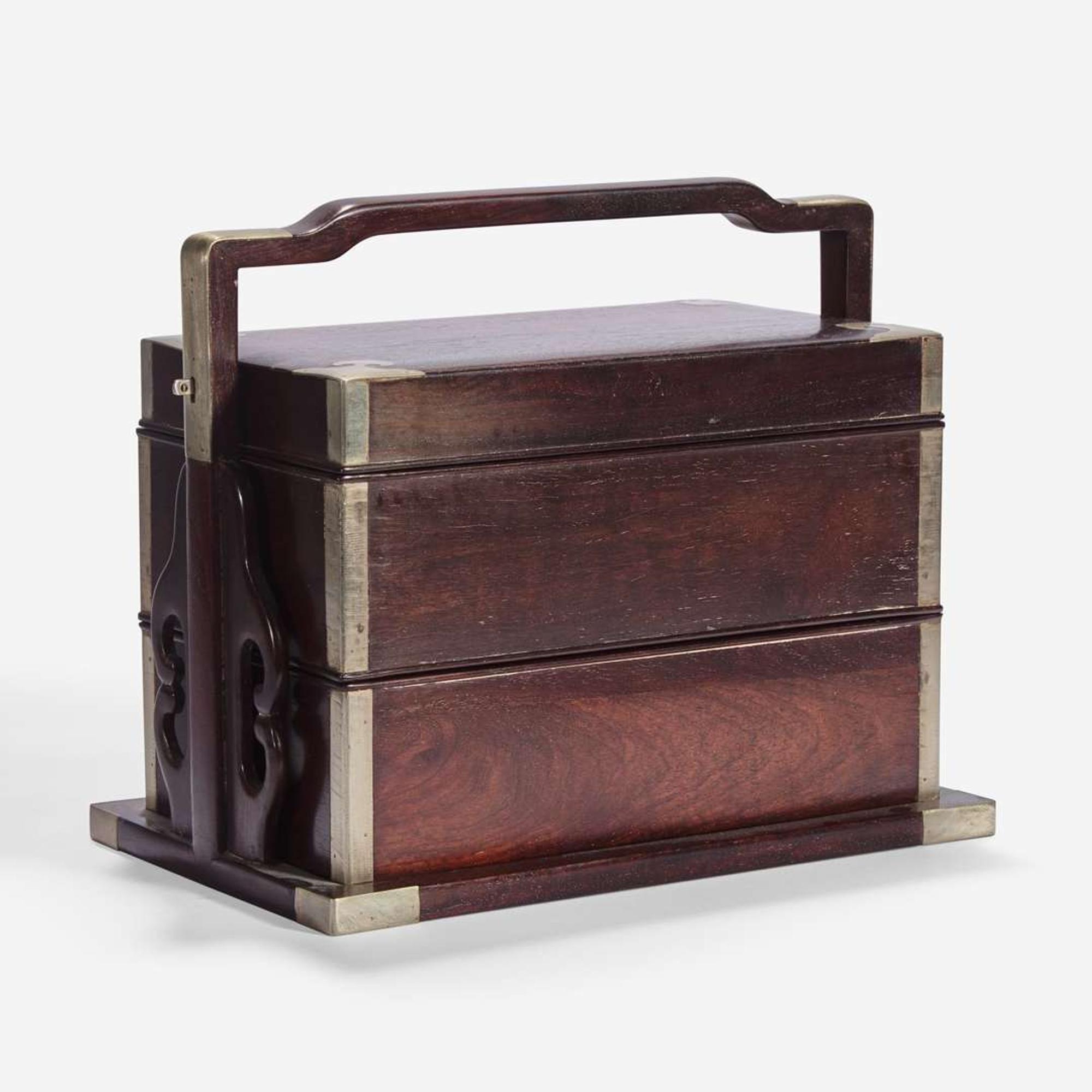 A Chinese stacking hardwood two-tier box, possibly zitan 双层提梁木盒 或紫檀
