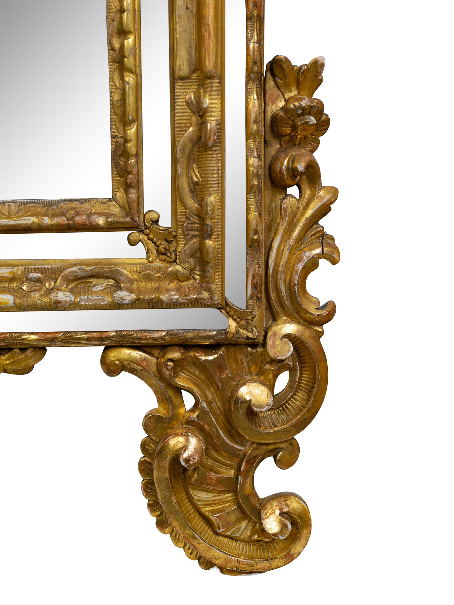 An Italian Baroque Style Giltwood Mirror