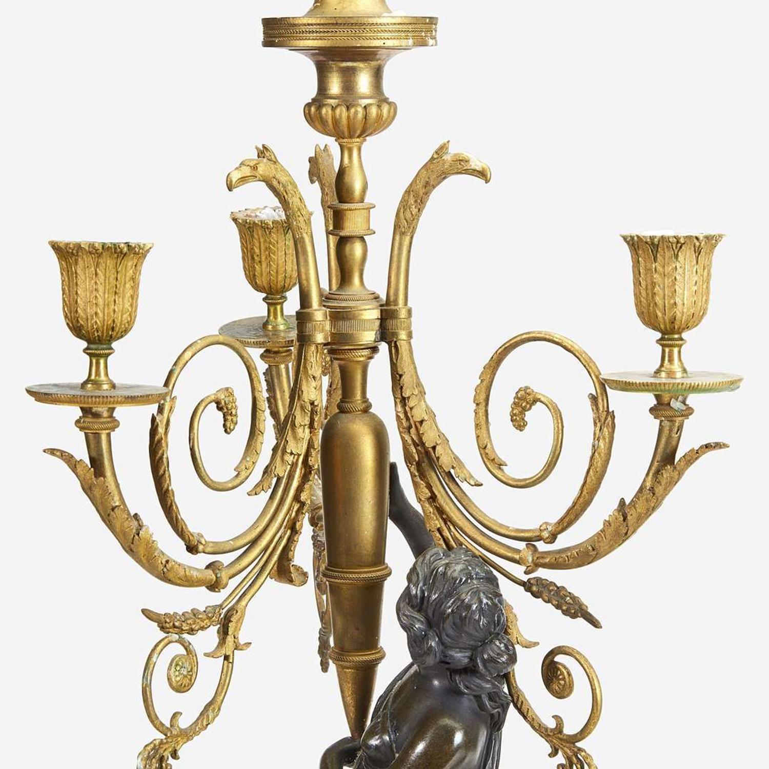 A Pair of Louis XVI Style Gilt and Patinated Bronze Figural Four-Light Candelabra 19th century