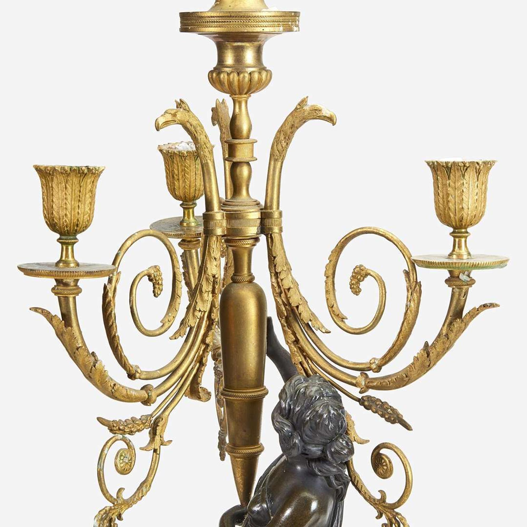 A Pair of Louis XVI Style Gilt and Patinated Bronze Figural Four-Light Candelabra 19th century