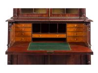 A Regency Carved and Figured Mahogany Secretary Bookcase