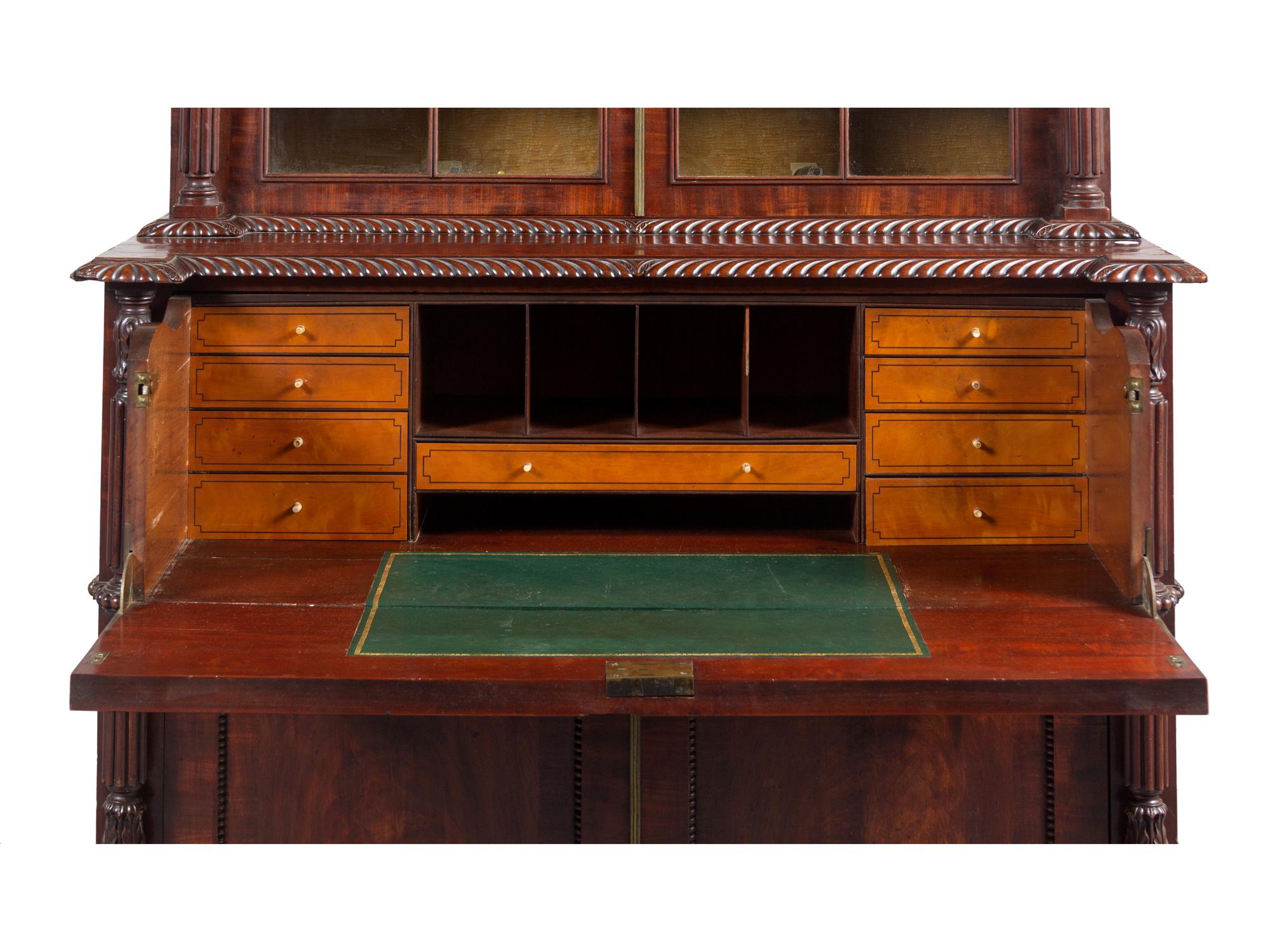 A Regency Carved and Figured Mahogany Secretary Bookcase
