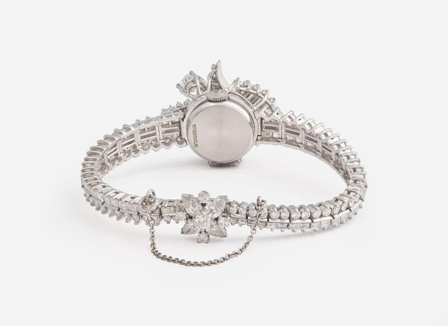 A Ladies Hidden Dial Platinum and Diamond Omega Watch