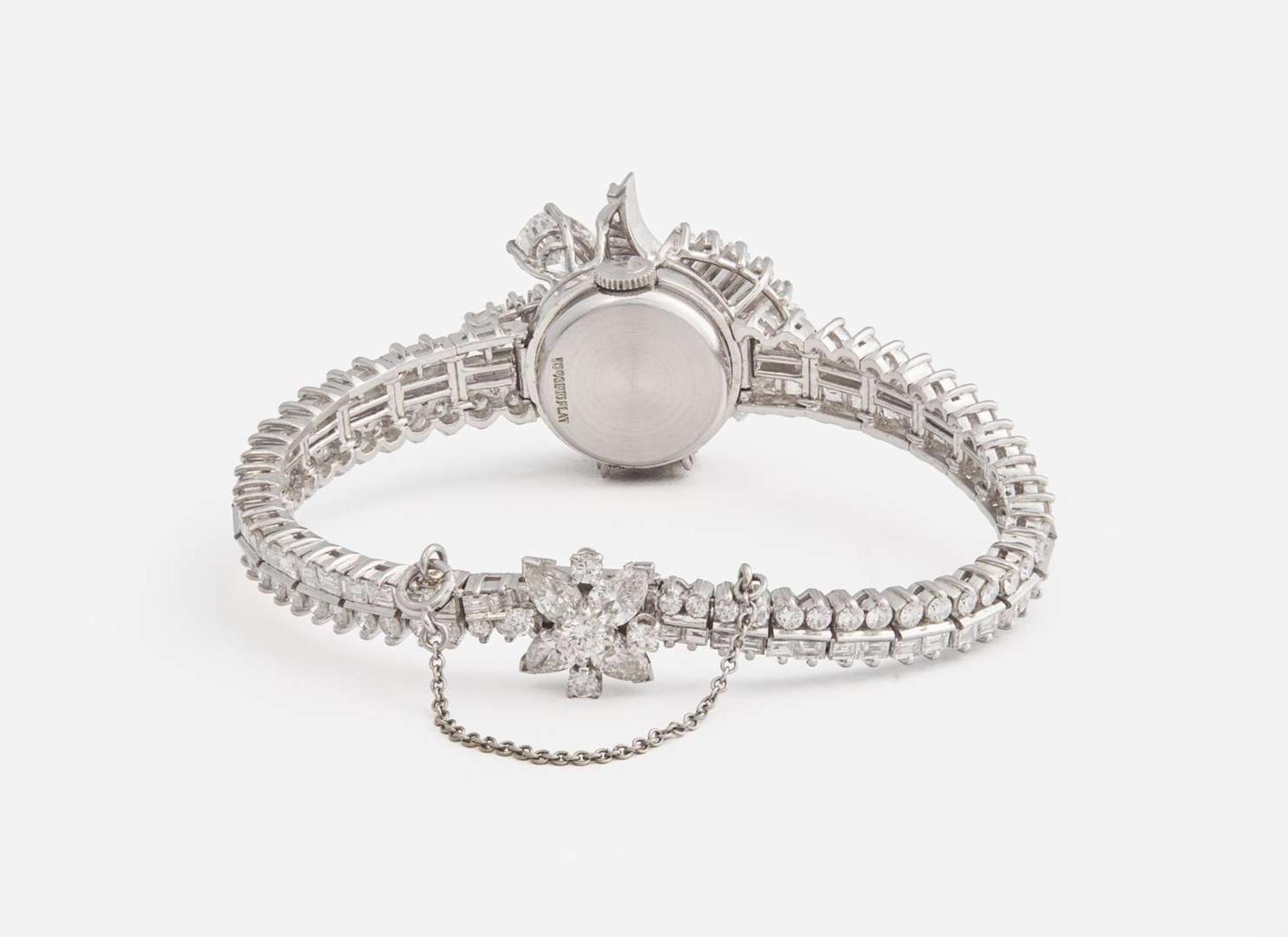 A Ladies Hidden Dial Platinum and Diamond Omega Watch