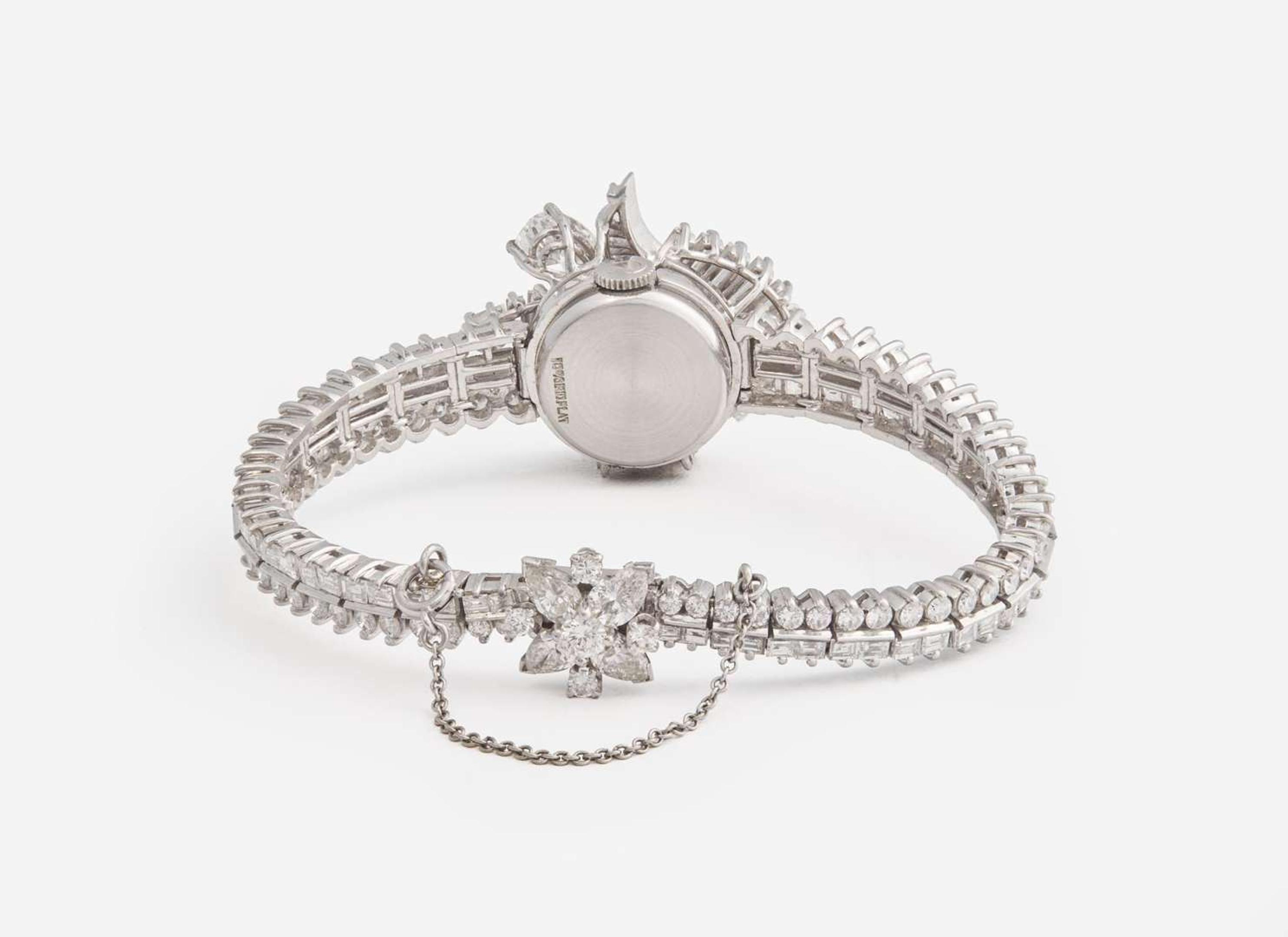 A Ladies Hidden Dial Platinum and Diamond Omega Watch