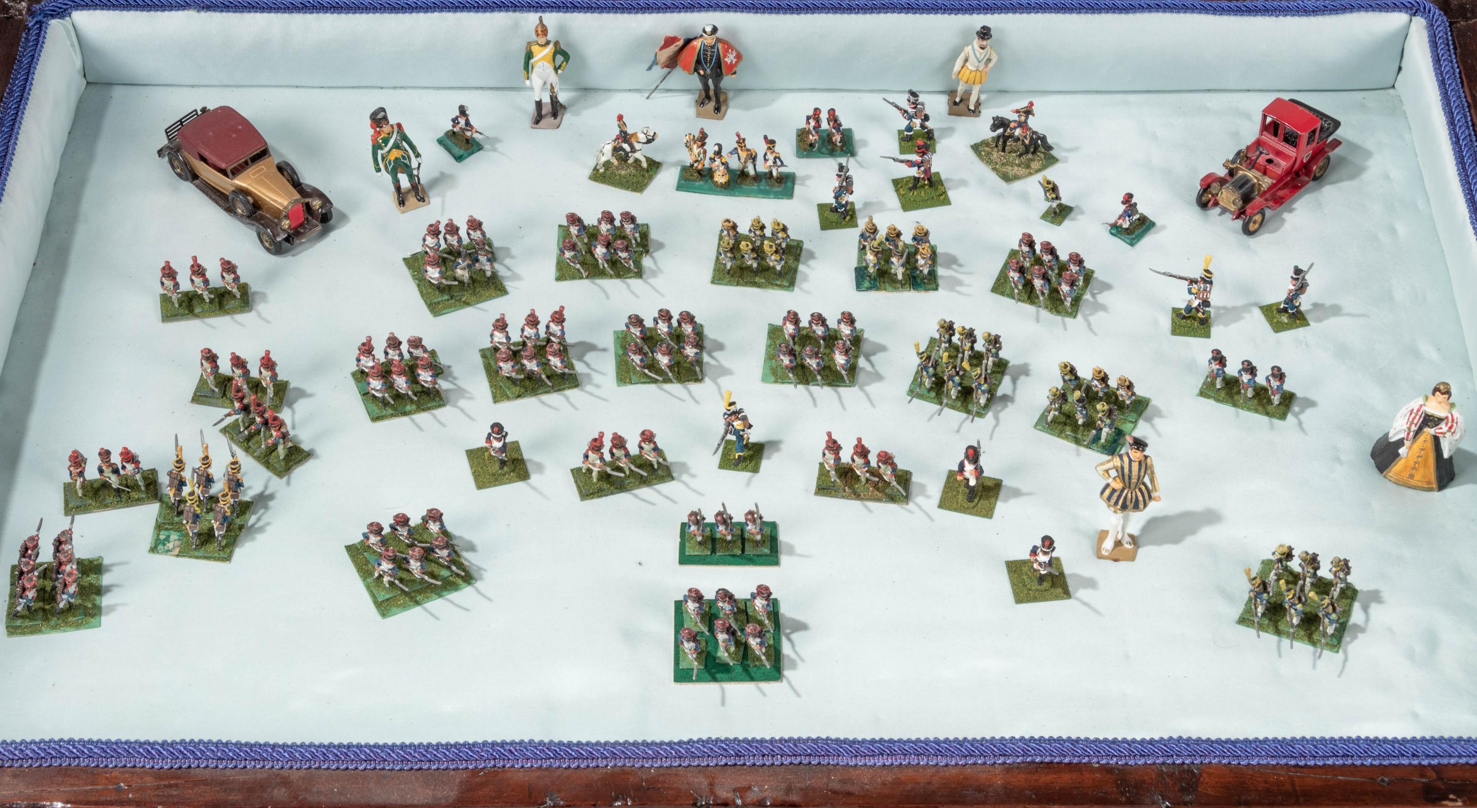 A Collection of Miniature Lead Soldiers in a Louis XV Style Vitrine Table